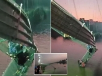 STRAVIČNA NESREĆA U INDIJI: Srušio se most, ljudi vise sa kablova, veliki broj mrtvih (VIDEO)